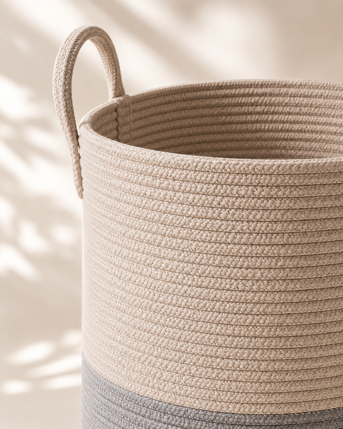 Close-up of the woven rope texture and soft looped handle on the LIND Carry Basket
